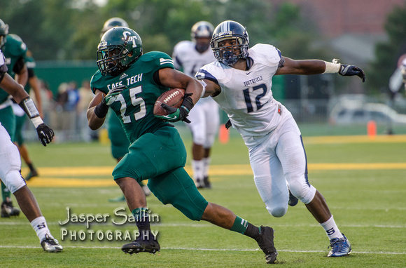 Cass Tech RB Mike Weber eludes the reach of Southfield DE Lawrence Marshall